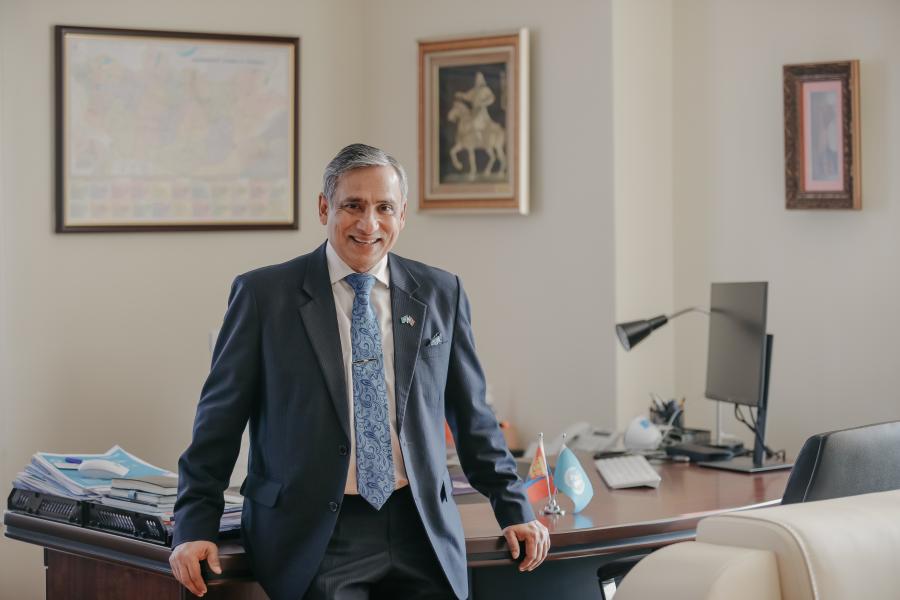 Tapan Mishra, UN Resident Coordinator for Mongolia, standing in front of his desk in his office